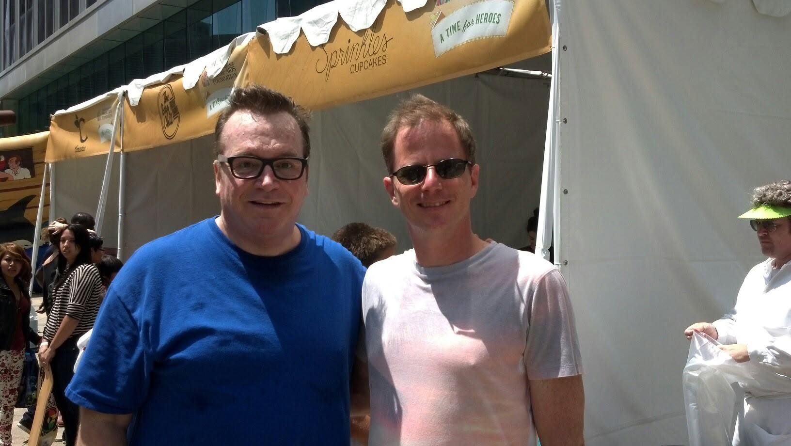 David DuVal with Tom Arnold at a Sprinkles Cupcakes tent